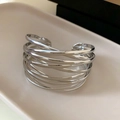 Polished silver layered criss-cross cuff bracelet with an open minimalist hollow design - Multilayer Wrap Open Bracelet / Silver