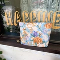 Sky blue floral cotton makeup bag with orange flower print and zipper closure - Blue Peony