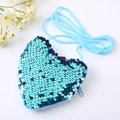 Detailed view of blue sequin heart-shaped crossbody bag with matching woven rope strap - Blue