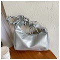 Detail of silver metallic shoulder bag featuring a ruched handle and side tie ribbon - Silver