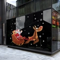Christmas window sticker showing Santa on a sleigh with reindeer on glass storefronts - Christmas Sleigh 6122