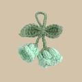 Detail of handmade crochet lily of the valley keychain in mint green and white yarn - Mint Green