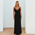 Elegant black backless maxi dress with V-neck ruffles and cross-tie straps on white background - S / Black