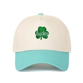 Detail of leaf embroidery and lucky text on a two-tone mesh trucker baseball cap - Adjustable / Cream/Lake Blue