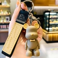 Simpatico portachiavi a forma di orso marrone con papillon giallo e cinturino nero - Marrone