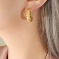 Polished golden ribbed hoop earrings for women featuring elegant twisted texture - Gold