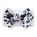 Elastic nylon baby headband featuring a large cow print bow in black and white - #3 Cow Print