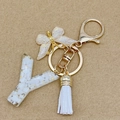 Letter Y resin keychain with gold leaf, white butterfly charm and elegant white tassel - Letter Y