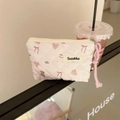 Detailed view of pink quilted floral pouch with baby bunny pattern and zipper strap - Heart Baby Bear