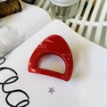 Glossy red D-shaped hair claw clip on white book page with a minimalist retro style - Medium (approx. 6cm) / Red