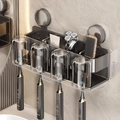 Wall-mounted dark grey toothbrush holder with four cups and storage slots - Family of 4 · 4 Cups
