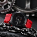 Digital sports watch with red silicone strap on industrial gear and chain background - 601 5th Gen Red