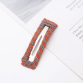 Detail of handmade orange and grey striped knitted BB hair clip on a white background - Rectangle / Orange Grey
