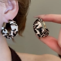 Macro shot of C-shaped leopard print hoop earrings with leather-like textured pleats - 13# Hoop - Brown - Round 3mm