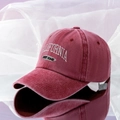 Detailed embroidery of California West Coast text on a washed red cotton baseball cap - Adjustable / Burgundy