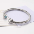 Bracciale rigido a cavo ritorto argento con finitura in pietra preziosa azzurra - Marzo/Azzurro