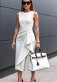 Detail of elegant white sleeveless dress showing tailored waist and pleated fabric texture - S / White