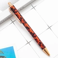 Chic leopard print retractable ballpoint pen with red glitter and rose gold trim - Red Leopard