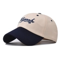 Close-up of contrast color cotton baseball cap with blue embroidery and beige crown - Adjustable / Beige/Navy Blue