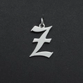 Macro detail of polished stainless steel gothic letter Z pendant with jump ring - Letter Z