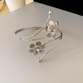 Silver flower arm cuff with sparkling crystals and geometric textured metal finish - Silver Flower Decoration Style