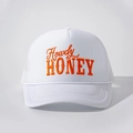 Detailed macro shot of white trucker hat featuring orange Howdy HONEY embroidery - Adjustable / All White