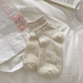 Calze beige traforate da donna con fiocco bianco delicato e bordo a balze elegante - Farina d'avena