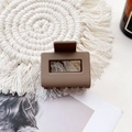 Medium brown matte rectangular hair claw clip for women shown on a white fringe mat - Small Matte Square Claw-Light Coffee
