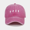 Detail view of pink washed cotton baseball cap with white LOVE hand gesture embroidery - Adjustable / Rose Red