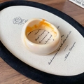 Artistic detail of marbled acrylic wide ring on a vintage poem tray background - Wide Bangle / Beige