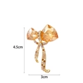 Bowtie crystal brooch with amber rhinestones and gold alloy ribbon, size 4.5cm by 3cm - Bow Shape (XX0088) / Champagne