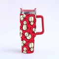 Close-up of 40oz Christmas tumbler with handle showing festive snowman pattern on red - Red Crowded Snowman Print