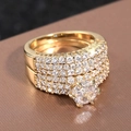 Luxurious gold-tone wedding ring set with sparkling zircon stones and round center diamond - US 7 / Gold