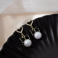 Elegant gold heart earrings with black bow and white pearl drops on silk background - Heart Bowknot Pearl Style (E4749-9)