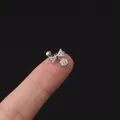 Orecchino a perno a fiocco in acciaio chirurgico con zirconi su sfondo nero puro - Fiocco Pendente (347-3#S) / Argento