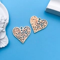 Two KC gold hollow heart pendants for DIY jewelry making on a blue background - 1pc KC Gold Hollow Heart Shape 19x18mm
