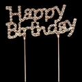 Close-up of rose gold Happy Birthday cake topper with rhinestones on a black background - Rose Gold