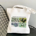 White Van Gogh canvas tote bag with floral print on a black metal grid chair - Van Gogh's Flowers (STD525-U)