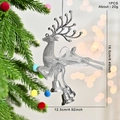 Silver glitter reindeer Christmas ornament with bow and bell hanging on tree - Silver