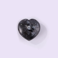 Polished heart-shaped labradorite gemstone with natural blue flash over deep grey base - Larvikite
