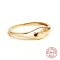 Detailed macro view of S925 sterling silver gold ring with ruby and star engraving - Gold-Cancer
