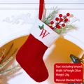 Red knit Christmas stocking with embroidered white letter W and holly berry detail - Letter W / Red