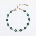 Detail of 18K gold plated chain bracelet with 14 sparkling green glitter beads and lobster clasp - Gold + Green