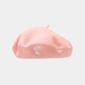 Close-up of pink wool beret featuring detailed white palm tree embroidery and soft texture - Pink