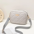Light grey crossbody bag with diamond lattice pattern and wide strap on white surface - Gray