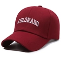 Classic dark red cotton baseball cap with white Colorado embroidery at a side angle - One Size(Adjustable) / Red