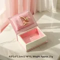 Pink book-shaped mini jewelry box with plush lining and golden ring display - Leatherette Paper / Mini Ring Box (Leatherette Paper) / Pink