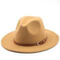 Detail of camel wool fedora hat with brown leather strap and golden horseshoe buckle - Camel