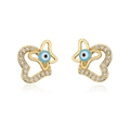 Macro detail of 18K gold evil eye stud earrings with cubic zirconia on white background - Heart Evil Eye