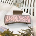 Detailed view of a brown matte hair claw clip featuring pink and grey sunflower patterns - Approx 10.5cm / Brown - Pink Hand-painted Sunflower